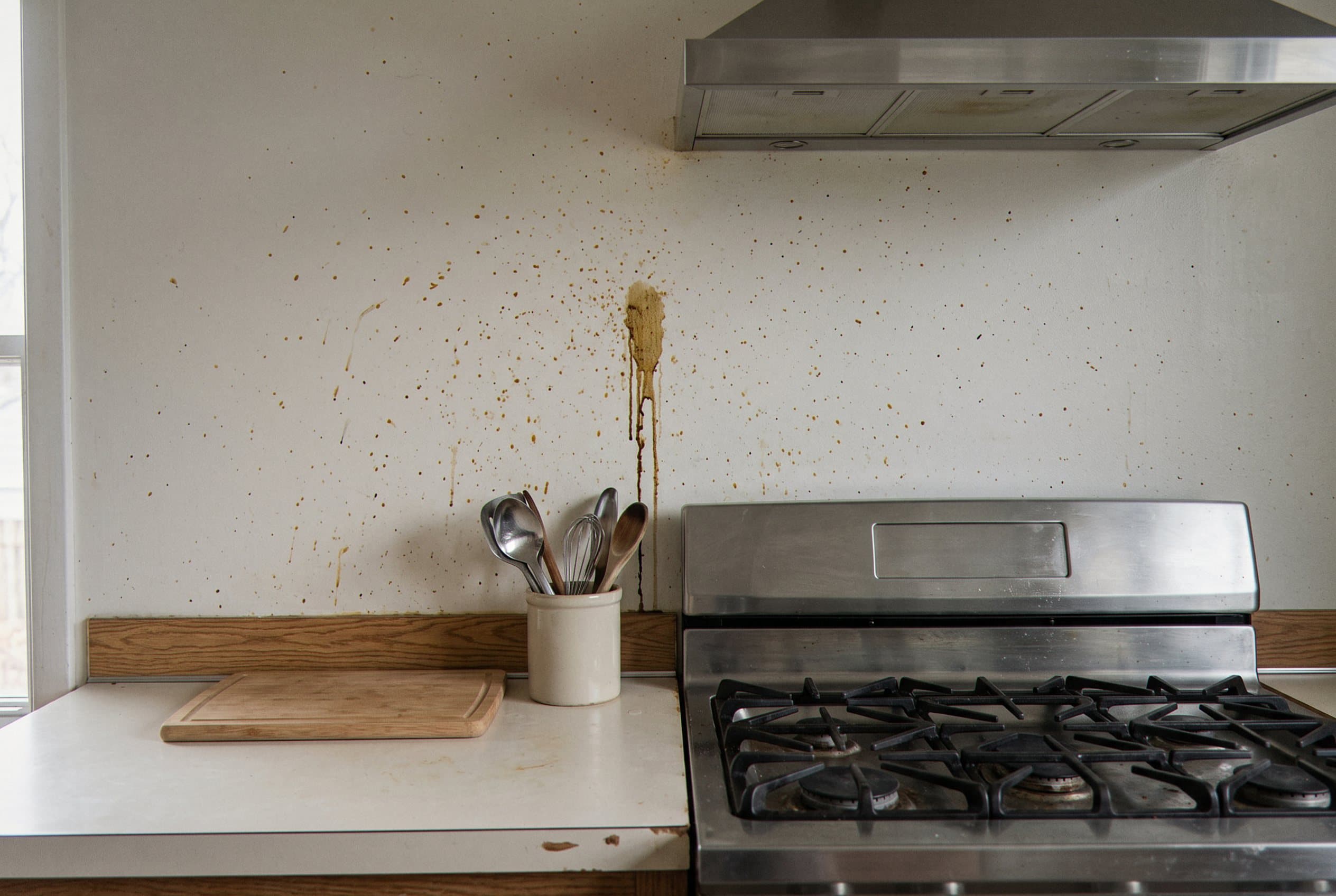 Grease-stained kitchen wall before a new backsplash