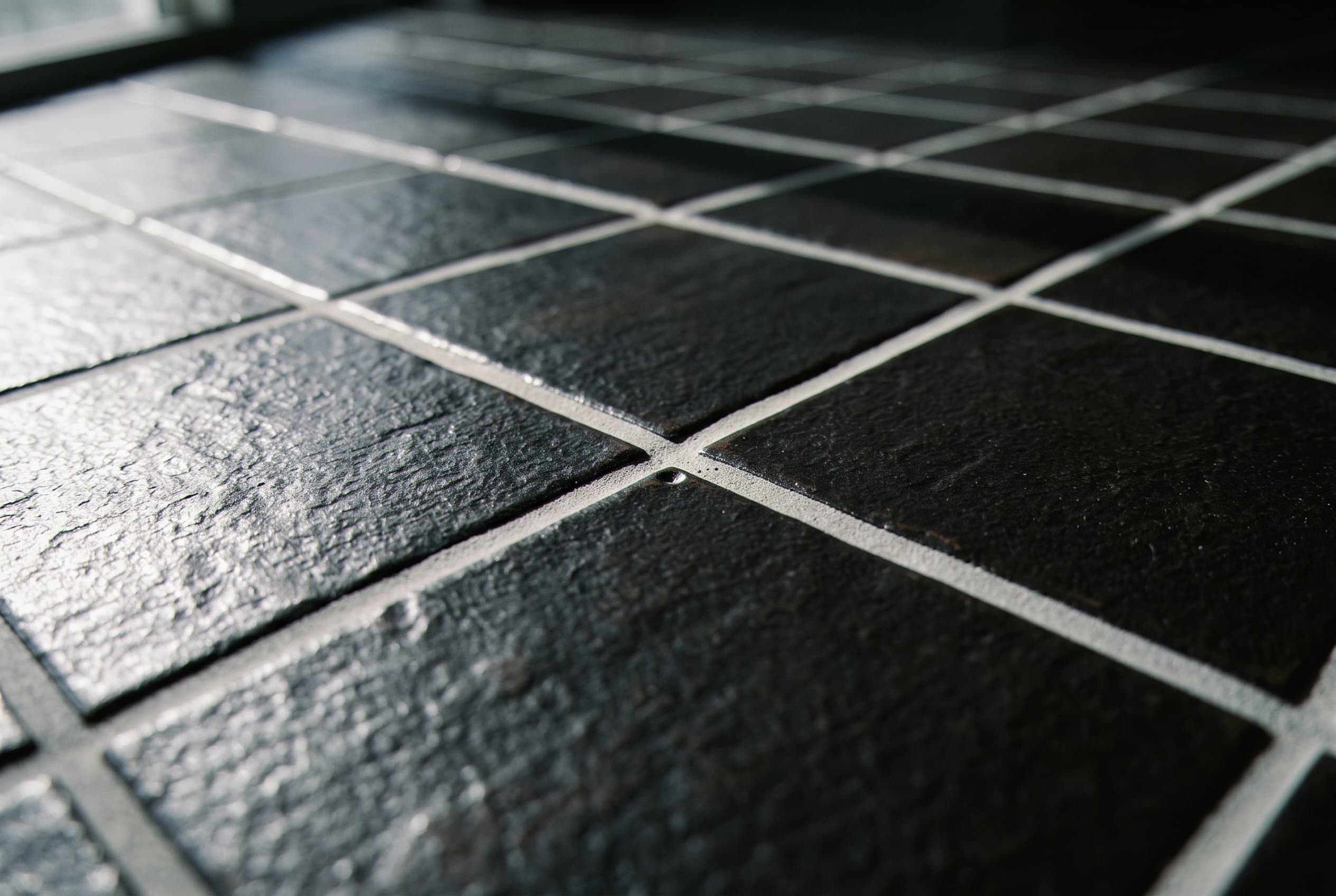 Clean grout lines on a dark slate tile floor