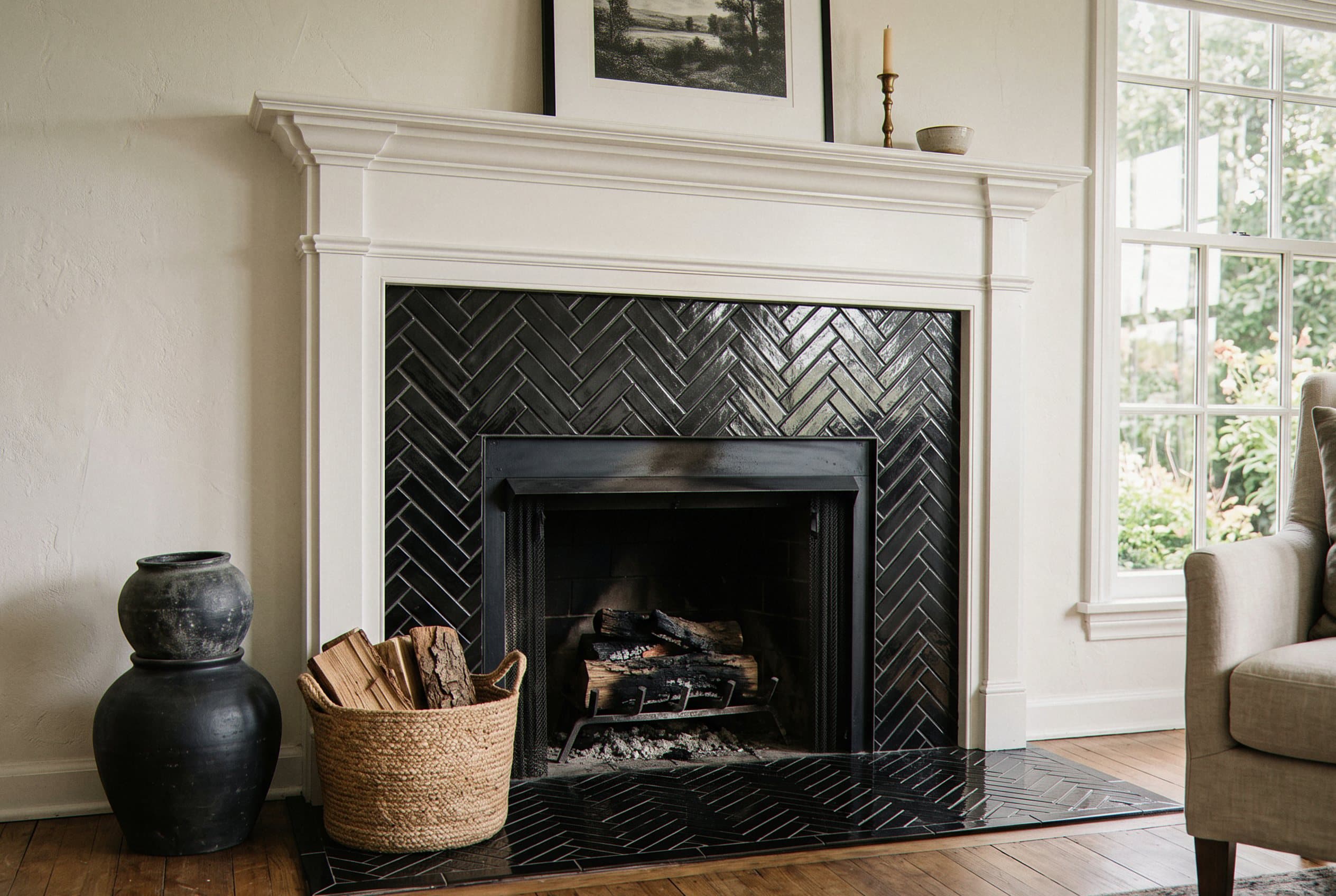 Black herringbone tile fireplace surround floor to ceiling